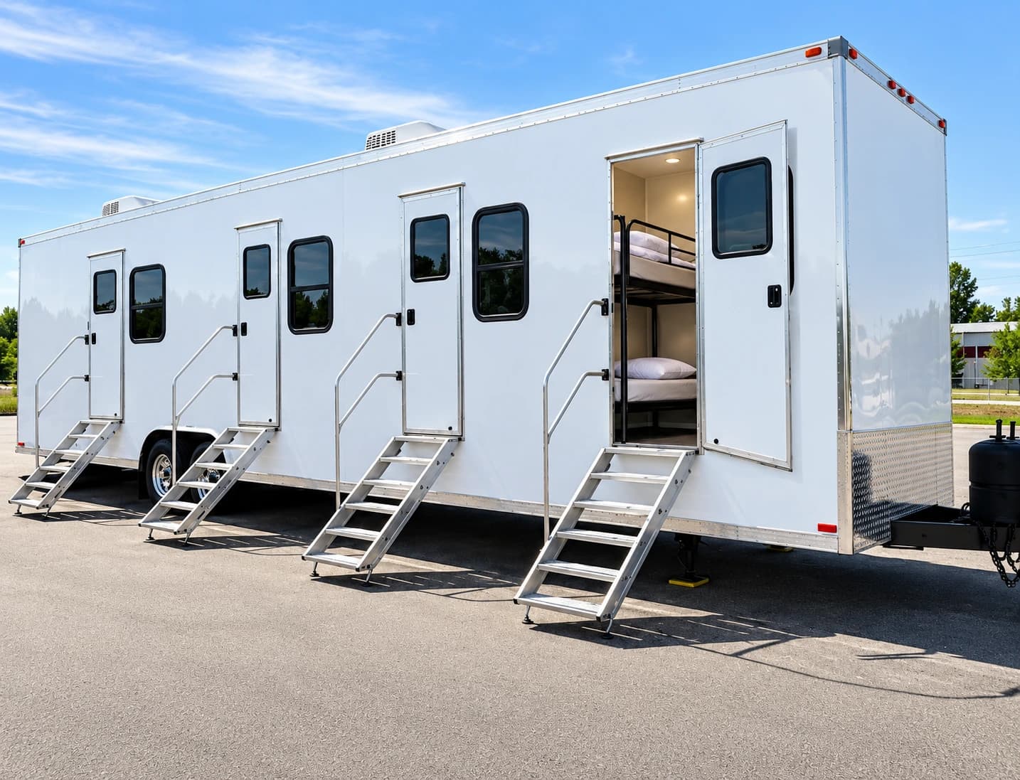 Sleeper trailer with separate entry stairs and an open bunk room