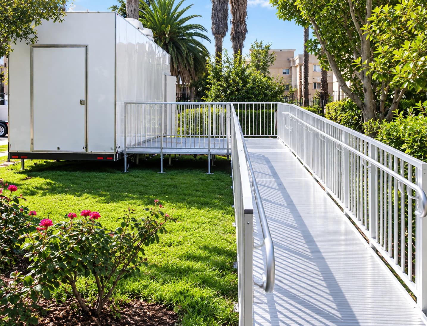 Modular access ramp and handrails beside portable accommodation