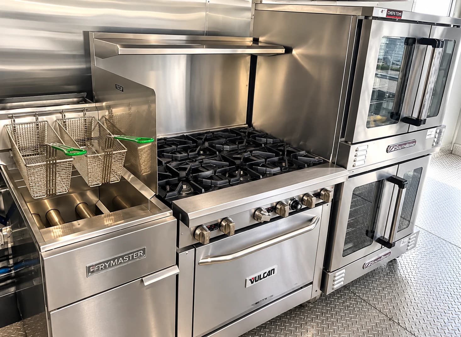 Commercial trailer cooking line with a griddle and gas range