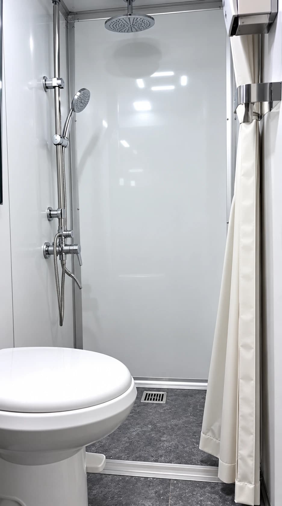 Individual shower and restroom stall with a sink