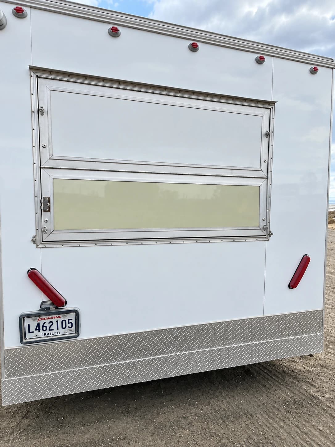 Mobile kitchen trailer exterior with a service window