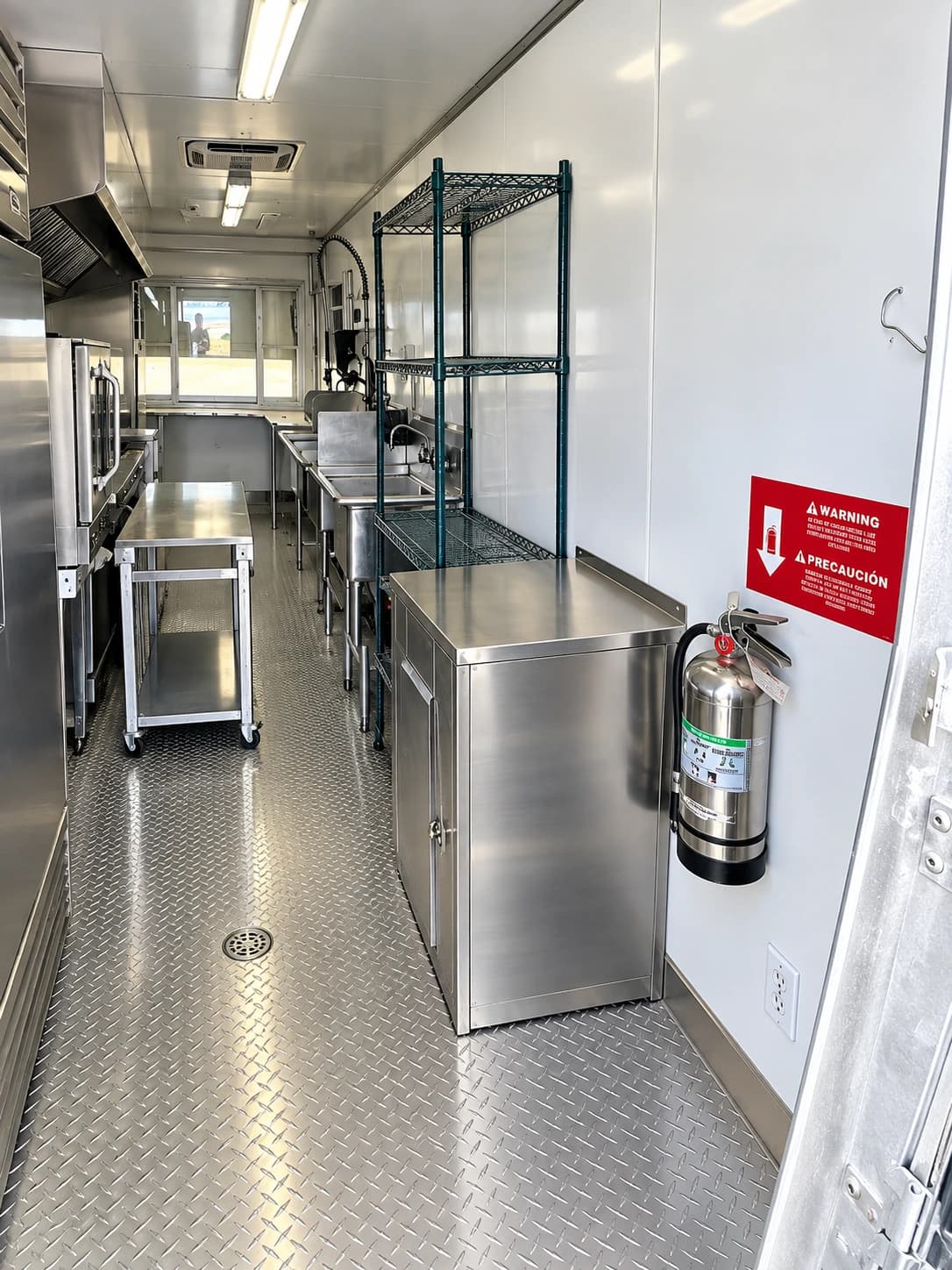 Commercial kitchen trailer interior with cooking and preparation equipment